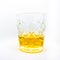 A close-up of a glass of wiskey isolated on a white background