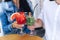 Close-up of glasses with drinks in the hands of men and women, Berry cocktail and mahito, clink glasses. Drink, people