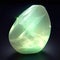Close-up of glowing Brazilian prehnite stone mineral crystal AI generated