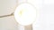 Close-up of glowing bulb with floor lamp. Media. Lamp with open round plafond included on white background. Lighting