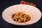 Close up gluten Free Spaghetti vegetarian pasta with champignon mushrooms, tomato, zucchini, cheese and vegetable served cherry