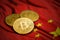 Close-up gold colored bitcoin coin on china flag.