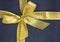 Close-up gold ribbon bow