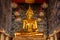 Close up of golden Buddha sculpture in temple. Golden Buddha Statue. Golden Buddha Sculpture at Wat Devaraj Kunchon Temple in