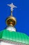 Close-up of golden cross on dome of orthodox church