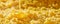 Close up of Golden Honey Drizzling on Crystallized Honeycomb Texture Natural Sweetener Background