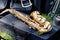 Close-up of a golden saxophone lying on a suitcase
