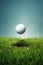 Close up of a golf ball in the air