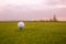 Close up of golf ball on the professional golf ground, ready for hit, sport concept