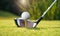 Close-up of golf club ready to hit ball from golf tee