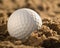 Close-up of golfball in sand
