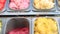 Close up of gourmet colorful gelato ice cream display in showcase fridge in shop