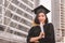 Close up of graduate student holding a diploma and looking at camera, Education concept