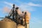 Close-up of grain bins with dryer and steam coming out