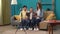 Close up of grandmother, daughter and kid grandson sitting on the sofa, taking selfie on smartphone with tripod.