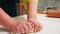 Close up of grandmother hands kneading