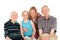 Close up of grandparents, mother and daughter together on a white studio background