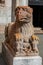 Close-up of granite griffin sculpture in front of Ferrara Cathedral.