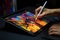 Close up of a Graphic Designer hand drawing on a digital tablet