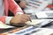 Close up. a graphic designer uses a graphics tablet sitting at Desk in Studio