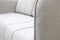 Close-up of gray sofa with armrest. Textiles, new furniture modern design. With free space for text.