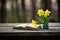 Close-up green book and a vibrant yellow daffodil on a rustic wooden table Generative AI