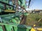 Close-up of a green combine harvester auger. Agricultural machinery