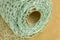 Close up of green crochet fabric roll