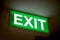 Close up Green Exit sign on door in the building