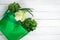 Close up a green grocery bag of mixed organic green vegetables o