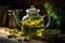 close-up of green herbal tea steeping inside a glass teapot on a wooden table