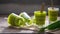 Close up green layer sweet cake in cups on a wooden table with fresh pandanus leaf with sunlight