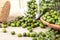 Close up green mung beans in wooden spoon on wood plate