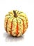 Close-up of a green orange Carnival or Festival pumpkin isolated on a white background.