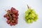 Close-up of green and red bunches of grapes