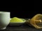Close up green tea, matcha power and whisk a cup of hot green tea on wooden table.traditional japanese drink