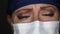 Close-up of Grief Stricken Tearful Doctor or Nurse Wearing Medical Face Mask