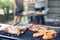 Close up grill with meat and sausage ready for socializing celebrate with friends at outsite home