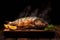 Close up of grilled fish food with salt on wooden plate with smoke on dark background