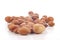 Close up of group of argan nuts on a white background.