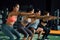 Close-up of Group of athletic young Asian people in sportswear doing squat and exercising at the gym.