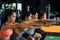 Close-up of Group of athletic young Asian people in sportswear doing squat and exercising at the gym.