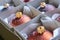 Close-up of a group of bronze colored christmas balls in a cardboard box