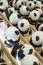 Close-up of a group of ceramic graffiti panda dolls