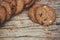 Close up of a group Chocolate chip cookies many stacked on dark old rustic