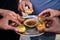 Close up, group of friends Hands taking pani puri Snacks from the plate - Concept of Sharing food or Indian evening street food
