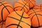 Close up of a group of many new basketball orange balls