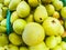 Close up of group of pears cultivated on the vegetable garden of home - buying fruits at the supermarket to do diet