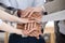 Close up group of people stacking hands