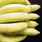 close up group of yellow banana ingredient of asia healthcare food with wood background